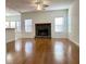 Spacious living room with hardwood floors and a stone fireplace at 4299 High Country Dr, Douglasville, GA 30135