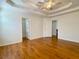 Large main bedroom with hardwood floors, coffered ceiling and ceiling fan at 4299 High Country Dr, Douglasville, GA 30135