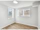 Bedroom with white walls, trim and window frames, and vinyl floors at 2185 Rochelle Way, Atlanta, GA 30349