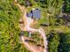 Aerial view of house and property showing surrounding woods at 701 Jones Mill Rd, Whitesburg, GA 30185