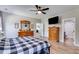 Main bedroom with dresser, large bed, and ensuite bathroom at 701 Jones Mill Rd, Whitesburg, GA 30185