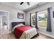 Bright bedroom with large windows and hardwood floors at 701 Jones Mill Rd, Whitesburg, GA 30185