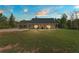 Gray house with covered porch and large yard at 701 Jones Mill Rd, Whitesburg, GA 30185