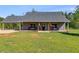 Gray house with covered porch and large yard at 701 Jones Mill Rd, Whitesburg, GA 30185