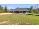 Gray house with covered porch and large yard at 701 Jones Mill Rd, Whitesburg, GA 30185