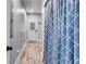 A long hallway with light gray walls and wood-look flooring at 701 Jones Mill Rd, Whitesburg, GA 30185