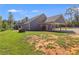 Gray house exterior with covered patio and spacious backyard at 701 Jones Mill Rd, Whitesburg, GA 30185