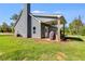 Gray house exterior with covered patio and green lawn at 701 Jones Mill Rd, Whitesburg, GA 30185