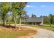 Ranch home exterior with covered porch and gravel driveway at 701 Jones Mill Rd, Whitesburg, GA 30185