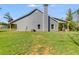 Gray house exterior with covered patio and large backyard at 701 Jones Mill Rd, Whitesburg, GA 30185