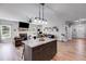 Open concept kitchen and living area with hardwood floors at 701 Jones Mill Rd, Whitesburg, GA 30185