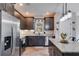Modern kitchen with stainless steel appliances and granite countertops at 701 Jones Mill Rd, Whitesburg, GA 30185