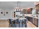 Modern kitchen with granite countertops and stainless steel appliances at 701 Jones Mill Rd, Whitesburg, GA 30185