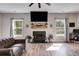 Spacious living room features a fireplace and large windows at 701 Jones Mill Rd, Whitesburg, GA 30185