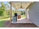Covered patio with built-in grill and ceiling fan at 701 Jones Mill Rd, Whitesburg, GA 30185