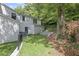 Landscaped backyard with retaining wall and fence at 1010 Edgewater Dr, Atlanta, GA 30328