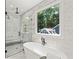 Spa-like bathroom with soaking tub and walk-in shower at 1010 Edgewater Dr, Atlanta, GA 30328