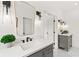 Modern bathroom with gray vanity, quartz countertop, and black matte fixtures at 1010 Edgewater Dr, Atlanta, GA 30328