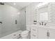 Modern bathroom with gray tile shower and white vanity at 1010 Edgewater Dr, Atlanta, GA 30328