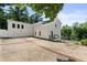 White two-story house with driveway and landscaping at 1010 Edgewater Dr, Atlanta, GA 30328