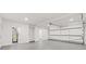 Spacious garage with open door, gray floor, and ample storage at 1010 Edgewater Dr, Atlanta, GA 30328