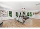 Bright Gathering room with hardwood floors and large windows at 1010 Edgewater Dr, Atlanta, GA 30328