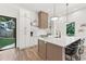 Modern kitchen with island and access to backyard at 1010 Edgewater Dr, Atlanta, GA 30328