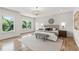 Bright main bedroom featuring hardwood floors and a plush bed at 1010 Edgewater Dr, Atlanta, GA 30328