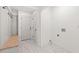 Bright mudroom with built-in bench, hooks, and tile flooring at 1010 Edgewater Dr, Atlanta, GA 30328