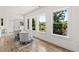 Light-filled sitting area with river views and hardwood floors at 1010 Edgewater Dr, Atlanta, GA 30328