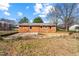 Brick home with a large backyard and retaining wall at 114 Woodhaven Dr, Stockbridge, GA 30281