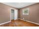 Spacious bedroom with hardwood floors and a large closet at 114 Woodhaven Dr, Stockbridge, GA 30281