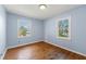 Charming bedroom with hardwood floors and light blue walls at 114 Woodhaven Dr, Stockbridge, GA 30281