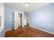 Bright bedroom with hardwood floors and a spacious closet at 114 Woodhaven Dr, Stockbridge, GA 30281