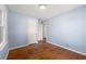 Light and airy bedroom with hardwood floors and ample space at 114 Woodhaven Dr, Stockbridge, GA 30281