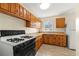 Bright kitchen featuring wood cabinets and modern appliances at 114 Woodhaven Dr, Stockbridge, GA 30281