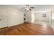 Living room with hardwood floors, and adjacent kitchen and dining area at 114 Woodhaven Dr, Stockbridge, GA 30281