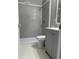 Modern bathroom featuring gray subway tile in the shower, hexagon tile floors, and gray vanity cabinet at 1971 Annette Ln, Austell, GA 30106