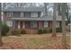 Brick house with gray roof, red door, and landscaping at 1971 Annette Ln, Austell, GA 30106