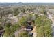 Panoramic aerial shot reveals this home's setting nestled among trees, offering privacy and scenic views at 3364 Sheree Trl, Stone Mountain, GA 30087