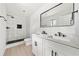 Bathroom with double vanity, black framed mirror, and a spacious tiled walk-in shower with a black showerhead at 3364 Sheree Trl, Stone Mountain, GA 30087