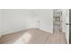 Bedroom featuring modern light-colored flooring and a doorway to another room at 3364 Sheree Trl, Stone Mountain, GA 30087