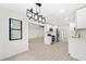 Modern kitchen featuring stainless steel appliances, white cabinets, and modern light fixtures at 3364 Sheree Trl, Stone Mountain, GA 30087