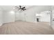 Spacious living room featuring modern flooring, a ceiling fan, and ample natural light at 3364 Sheree Trl, Stone Mountain, GA 30087