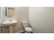 Simple bathroom with pedestal sink and toilet at 3732 Stonebranch Ln, Loganville, GA 30052