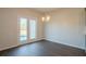 Bright dining area with hardwood floors and backyard access at 3732 Stonebranch Ln, Loganville, GA 30052