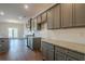 Gray cabinets, granite countertops, and kitchen island at 3732 Stonebranch Ln, Loganville, GA 30052