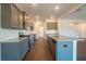 Modern kitchen featuring gray cabinets and granite countertops at 3732 Stonebranch Ln, Loganville, GA 30052