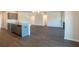 Open concept living space with kitchen island and hardwood floors at 3732 Stonebranch Ln, Loganville, GA 30052