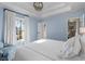 Bright bedroom with tray ceilings, light blue walls, and a decorative chandelier at 4266 Valley Trail Se Dr, Atlanta, GA 30339